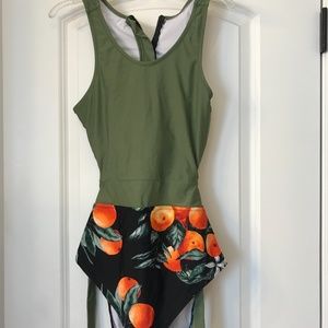 One piece solid top peach print bottom swimsuit